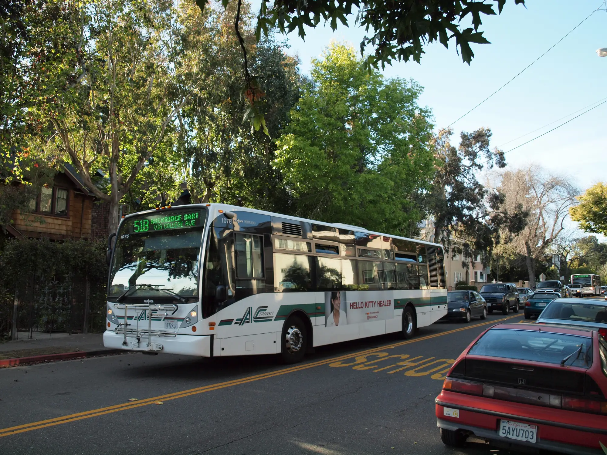 An AC Transit bus on the street.